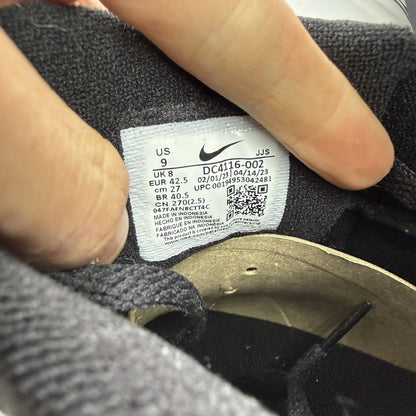 Nike Air Max 90 black trainers with laser blue accents and signature logo.