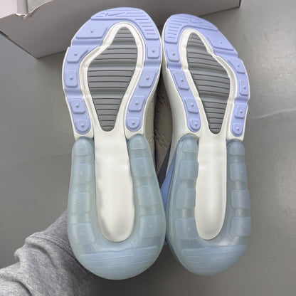 Nike grey trainers with Air Max cushioning and logo detail on the tongue.