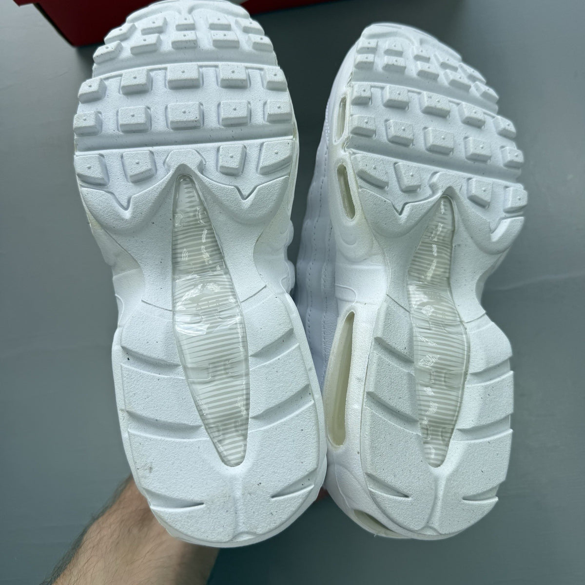 Nike Air Max 95 Recraft white trainers with distinctive layered design and air cushioning.