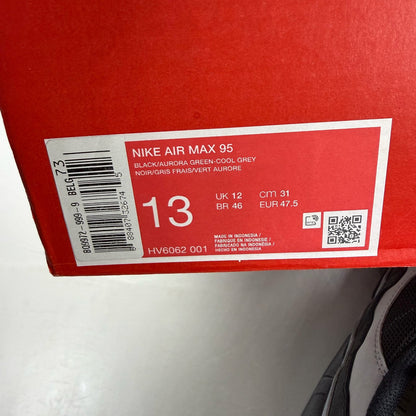 Nike Air Max 95 black trainers with Aurora Green and Grey accents, featuring iconic logo.