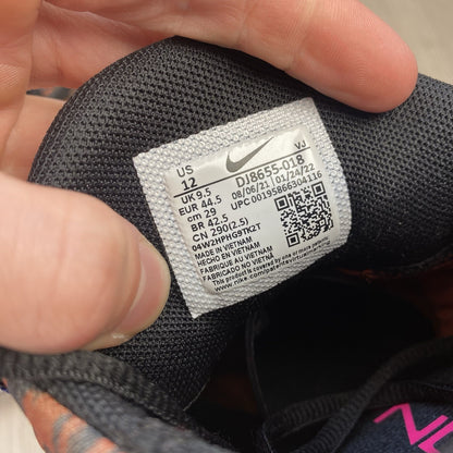 Nike Free Metcon 4 trainers black with tiger burnt sunrise accents and logo detail.