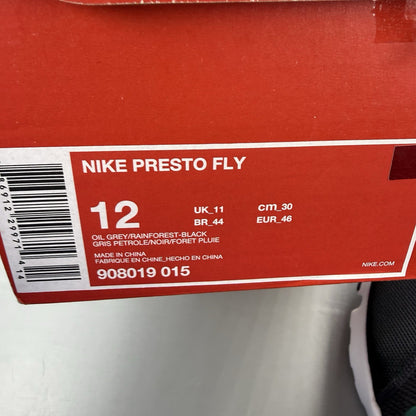 Nike Presto Fly black trainers with grey accents and white sole, featuring logo details.