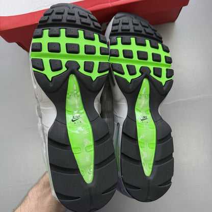 Nike Air Max 95 trainers black with grey and green accents, featuring signature logo.