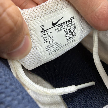 Nike T-Lite XI white trainers with obsidian and black accents, featuring a sleek design.