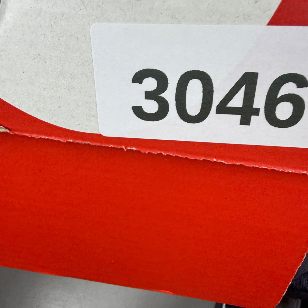 Nike Air Max 90 blue trainers with dark obsidian accents and signature swoosh logo.