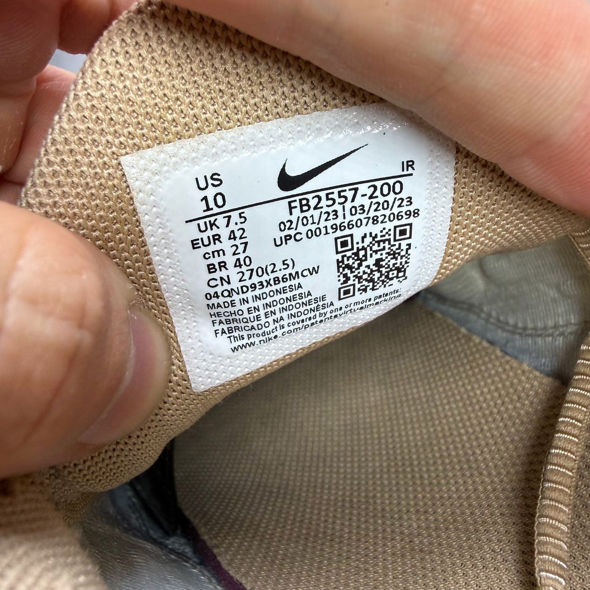Nike Air Max Plus TN beige trainers with iconic logo and sleek design.