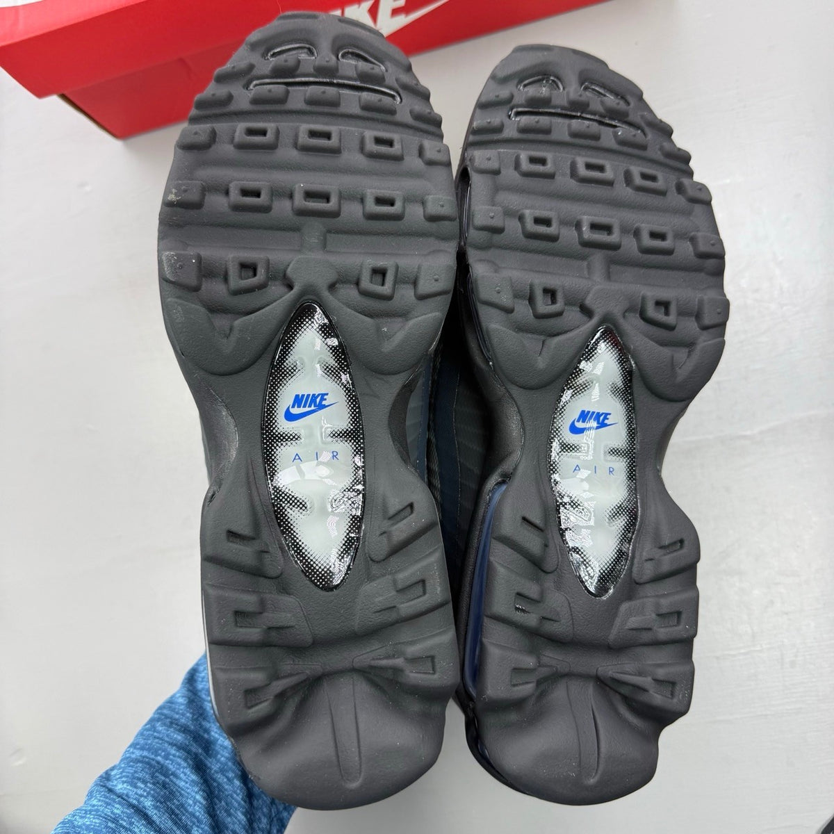 Nike Air Max 95 Ultra black with racer blue and anthracite grey accents, sleek design.