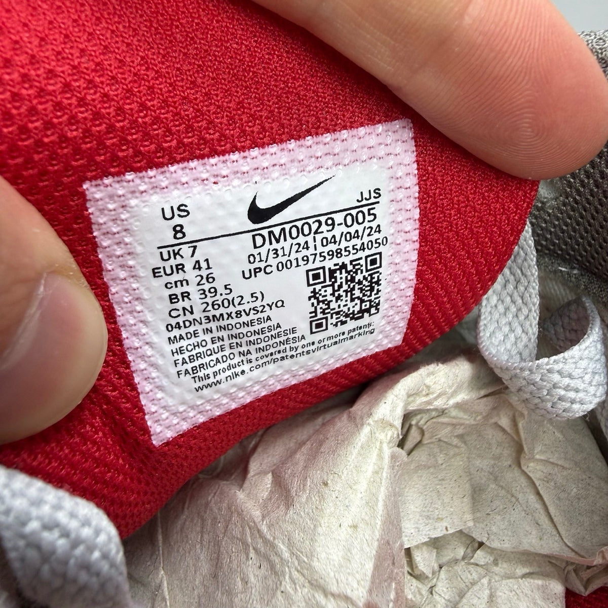 Nike deck shoes grey with red accents and logo, brand new in box.