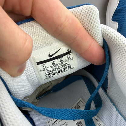 Nike Air Max 1 blue trainers with essential design and logo detail.
