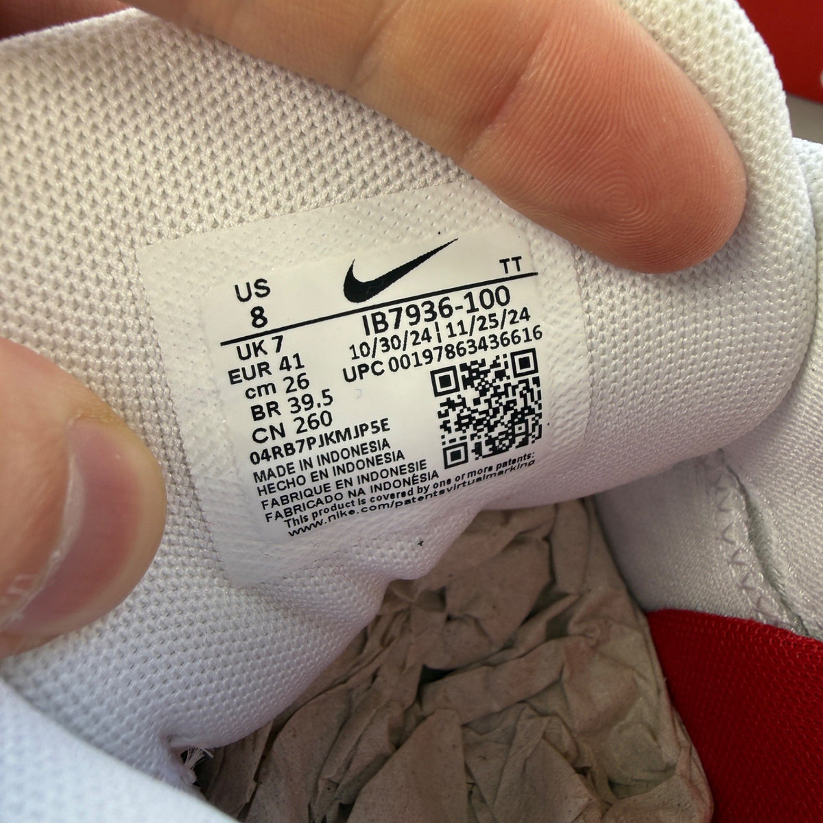 Nike trainers white with red accents and big bubble sole design.