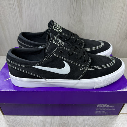 Nike black SB Zoom Stefan Janoski RM sneakers with white logo and sleek design.