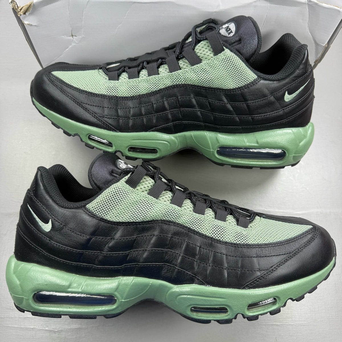 Nike Air Max 95 ID green trainers with grey accents and black detailing.