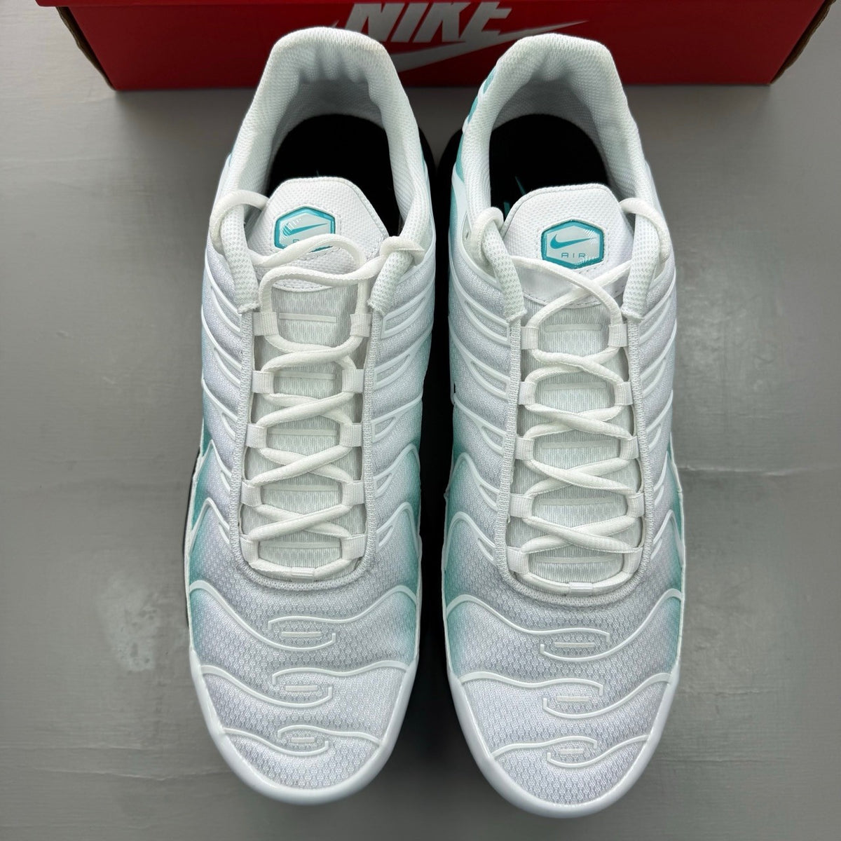 Nike deck shoes white with blue and black accents, featuring signature swoosh logo.