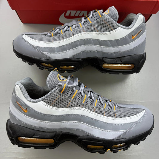 Nike Air Max 95 grey trainers with sundial accents and signature logo details.