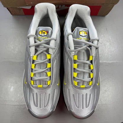 Nike Air Max Plus 3 TN metallic silver with yellow accents and logo details.