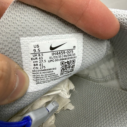 Nike Air Max Plus TN trainers grey with blue accents and signature swoosh logo.