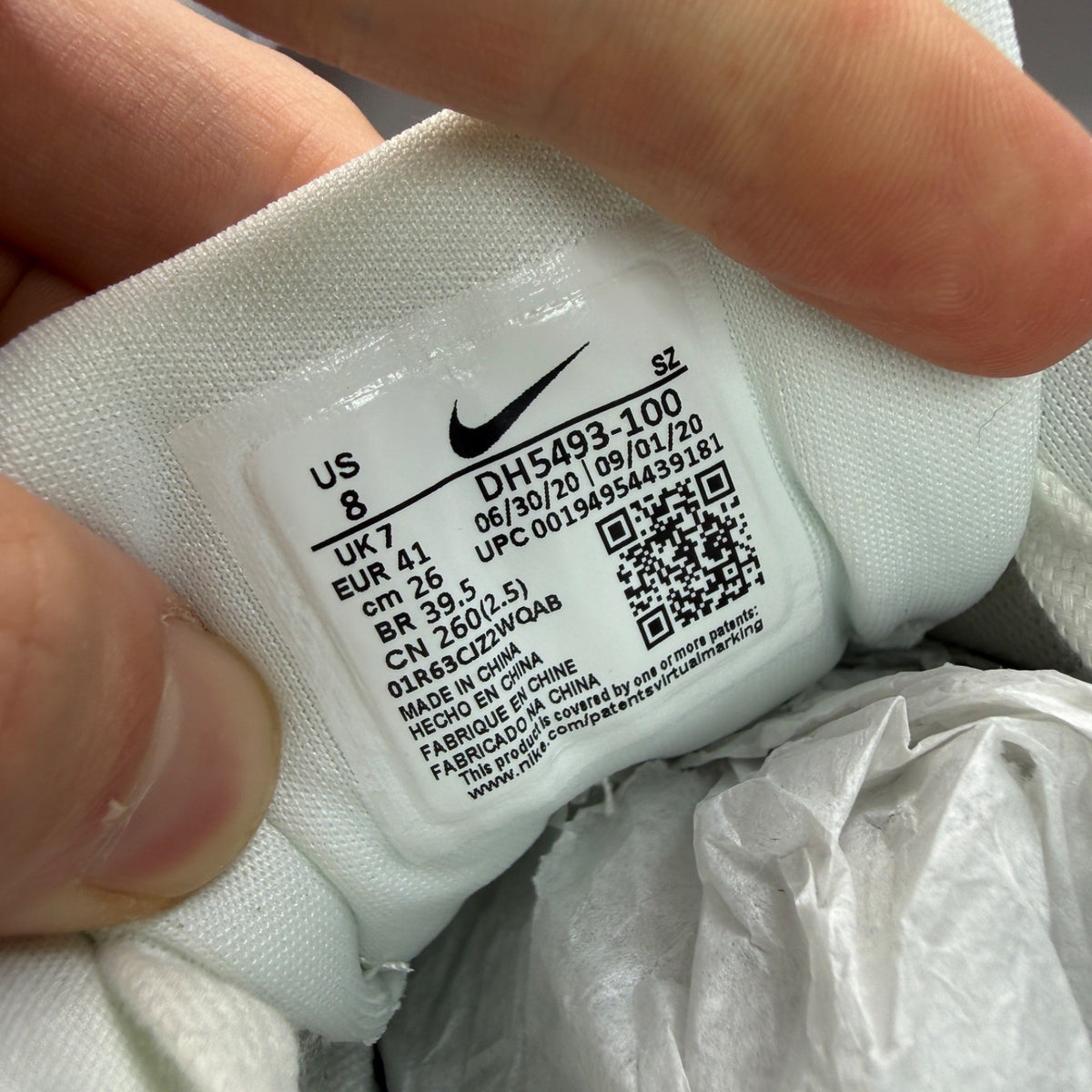 Nike Air Max 1 white trainers with rubberized details and classic logo design.
