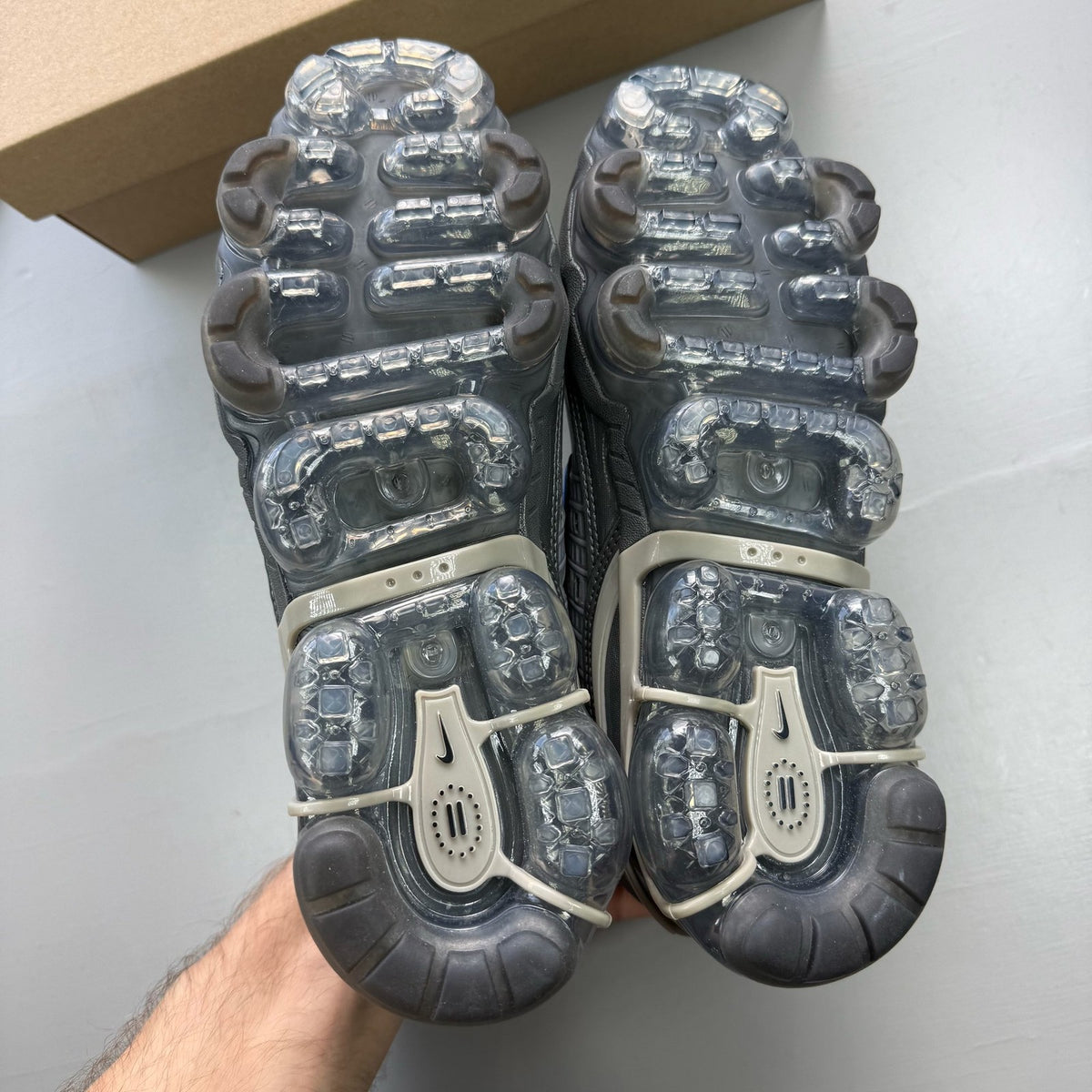 Nike Air VaporMax 360 grey trainers with unique design and textured material.