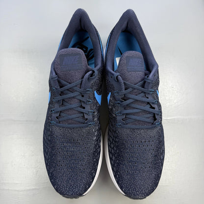 Nike blue trainers with Air Zoom cushioning and logo detailing on the side.