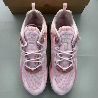 Nike Air Max 270 React white trainers with pink accents and logo detail.