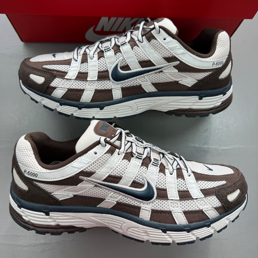 Nike deck shoes brown with white accents and logo detailing.