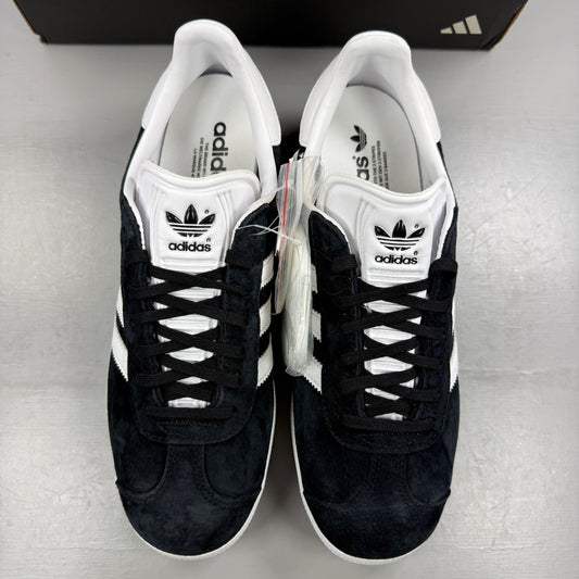 Adidas black athletic shoes with white stripes and logo, size UK 7.5.