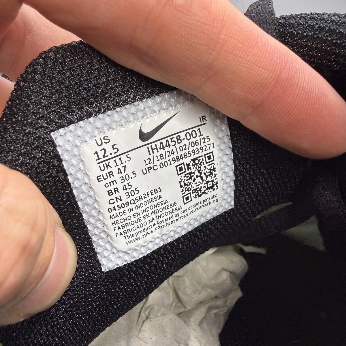 Nike trainers black with yellow heat map pattern and signature swoosh logo.