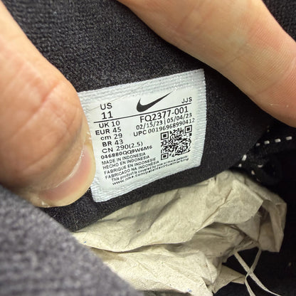 Nike Air Max 90 black trainers with volt and cool grey swoosh logo.