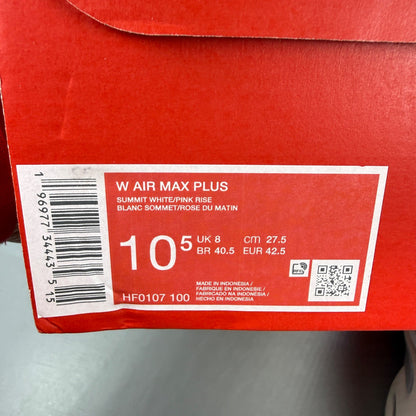 Nike athletic shoes white with pink accents and signature Air Max Plus design.