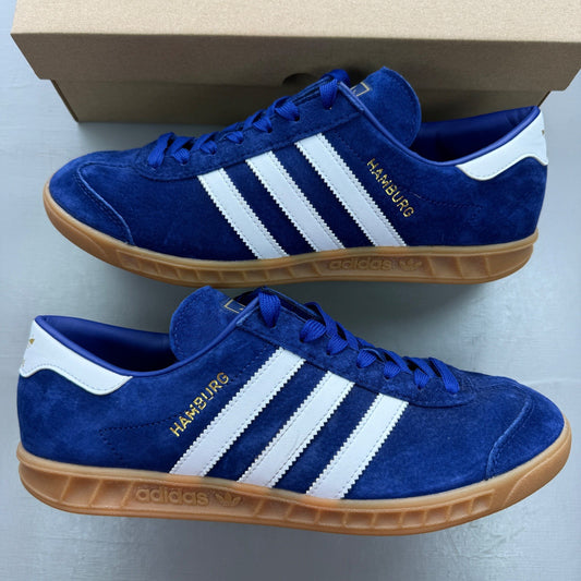 Adidas deck shoes victory blue suede with white stripes and gum sole.