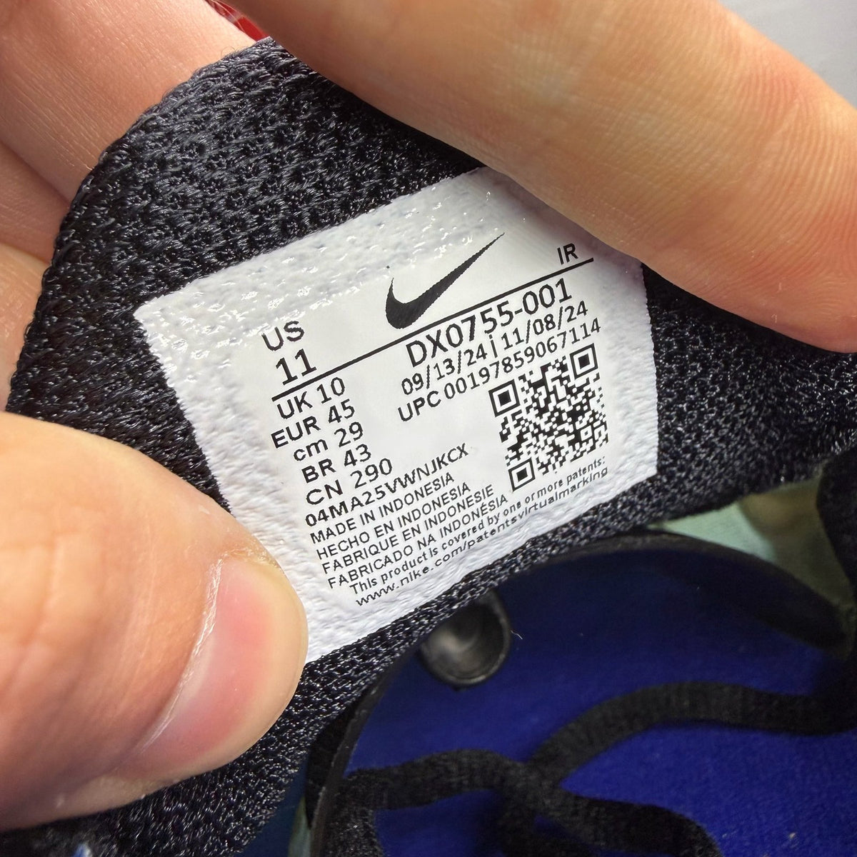 Nike Air Max Plus TN blue trainers with black accents and signature swoosh logo.