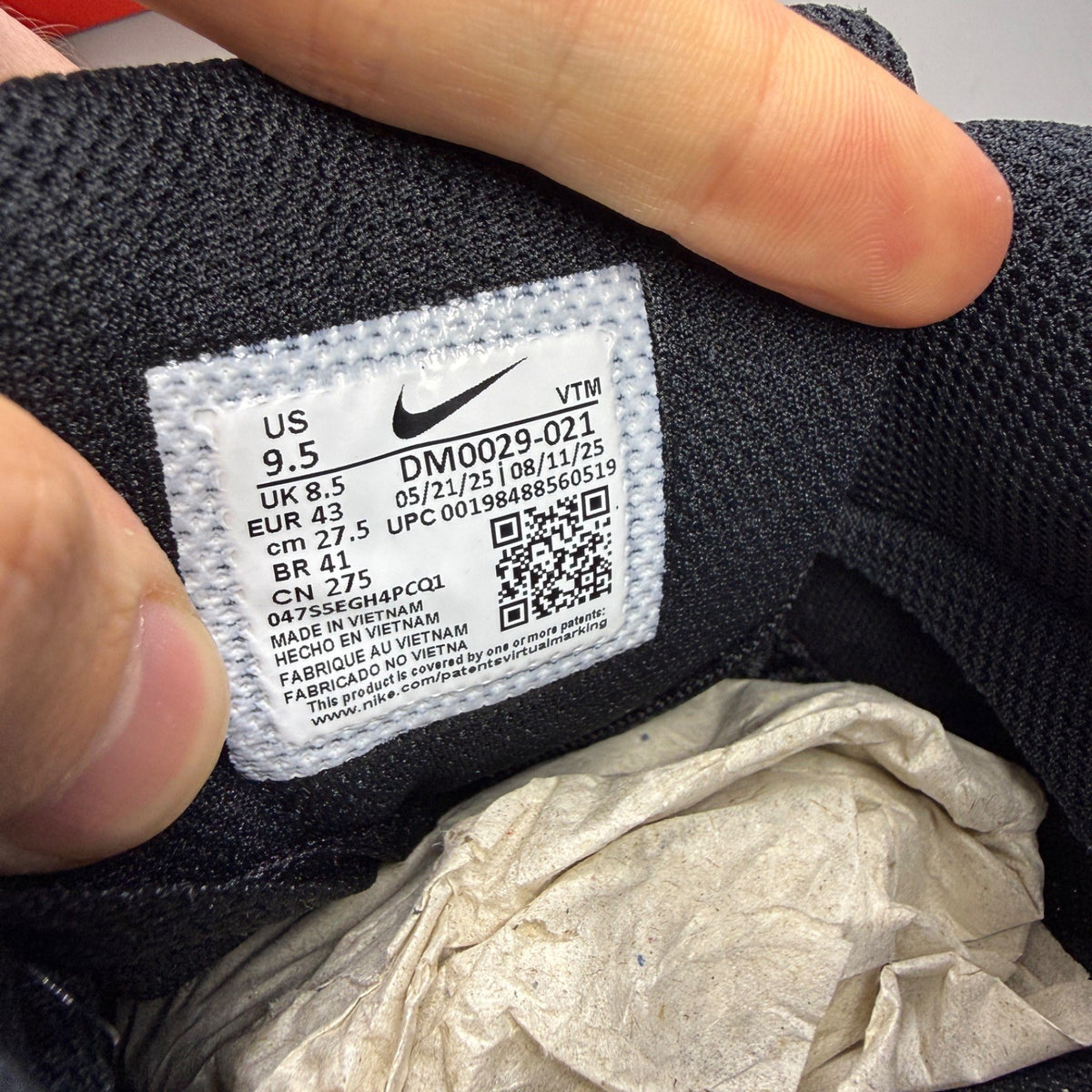 Nike deck shoes black with sapphire accents and signature swoosh logo.