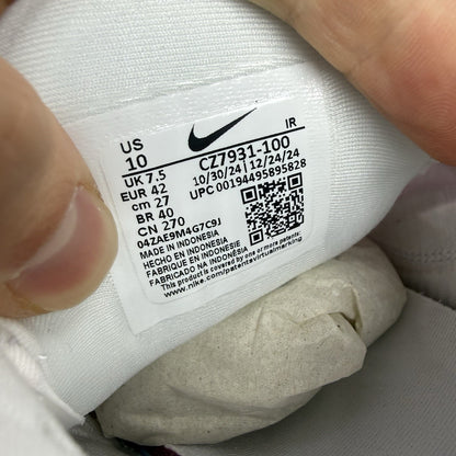 Nike Air Max Plus TN white trainers with fire pink foam fade and logo detailing.