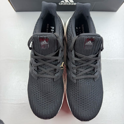Adidas black Ultra Boost trainers with white accents and signature three-stripe logo.