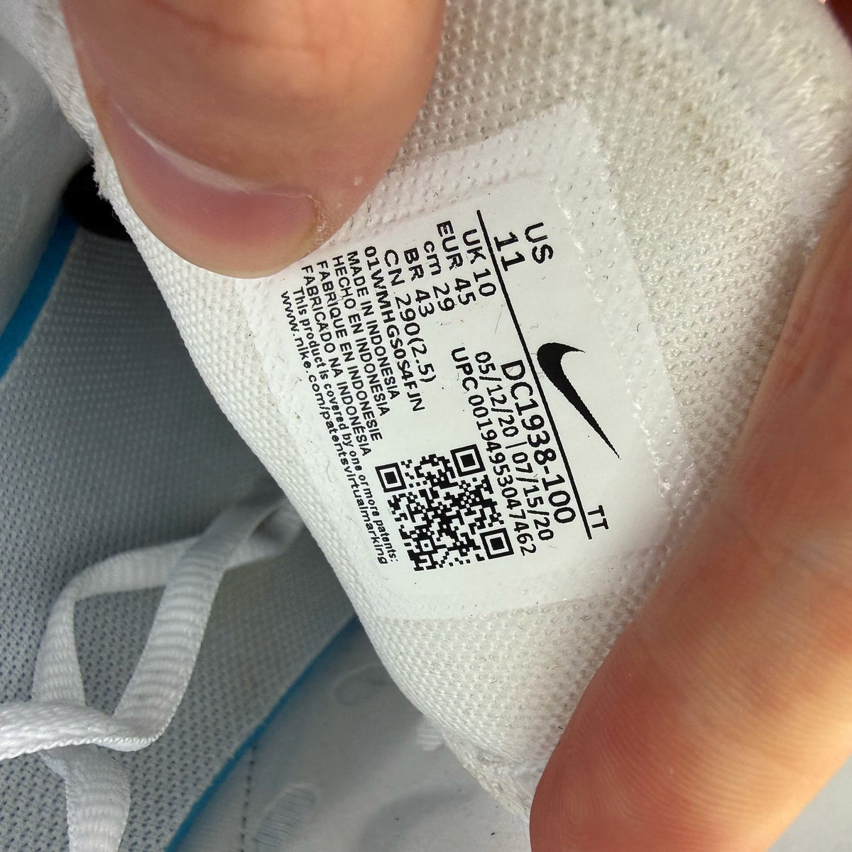 Nike Air Max 270 white trainers with laser blue accents and logo detail.