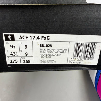 Adidas football boots white with blue and pink accents, featuring logo and textured material.