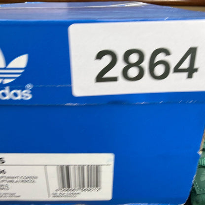 Adidas green trainers with white accents and logo detailing, brand new in box.