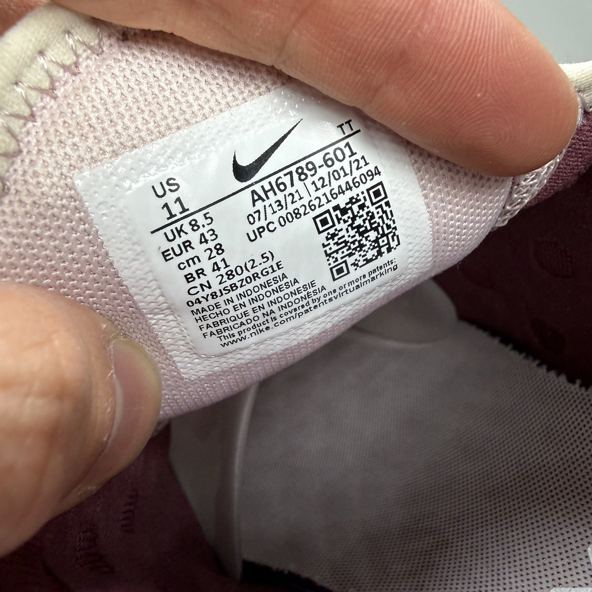 Nike Air Max 270 pink trainers with vintage wine accents and white sole.
