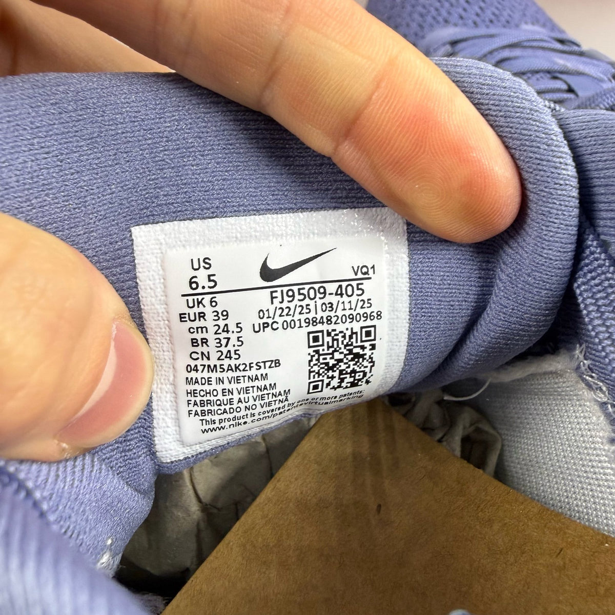 Nike blue trainers with mesh upper and swoosh logo, size UK 6.