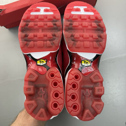Nike Air Max Plus TN Ultra red trainers with black accents and signature logo.