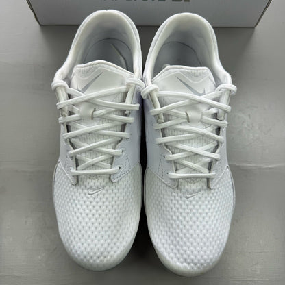 Nike white trainers with gum sole and silver accents, featuring breathable mesh upper.