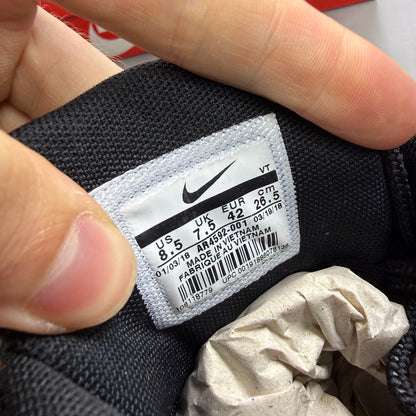 Nike Air Max 95 black trainers featuring unique safari print and signature logo.