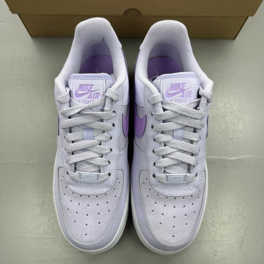 Nike Air Force 1 '07 purple trainers with classic white sole and logo detail.