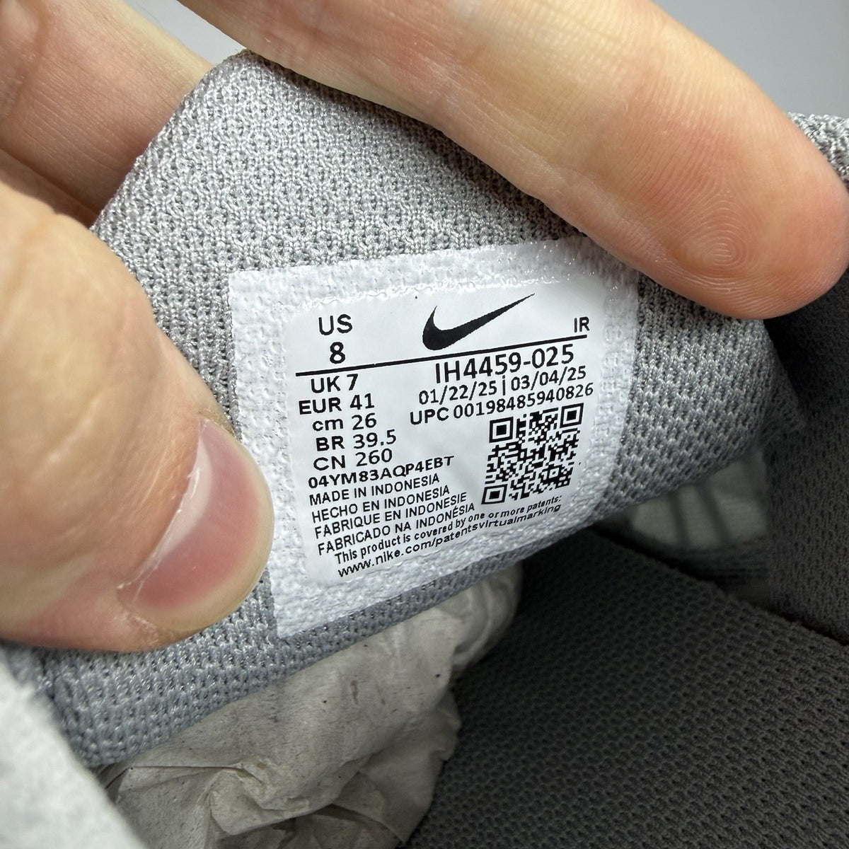 Nike Air Max Plus TN trainers grey with racer blue accents and unique design details.