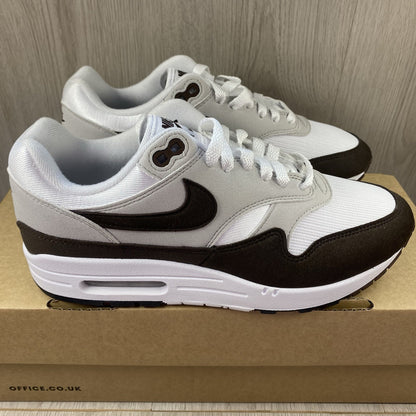 Nike Air Max 1 '87 trainers white with grey accents and brown detailing.
