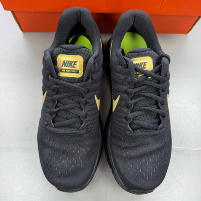 Nike Air Max 2017 GS trainers black with metallic gold accents and logo detail.