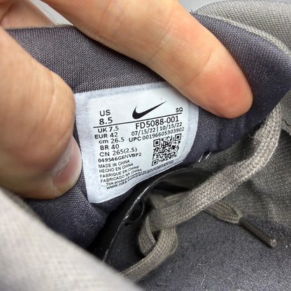 Nike grey deck shoes with premium crepe sole and logo detailing.