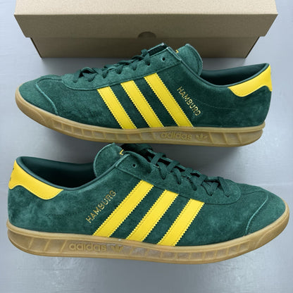 Adidas Hamburg green trainers with gold and yellow accents, featuring classic logo detail.