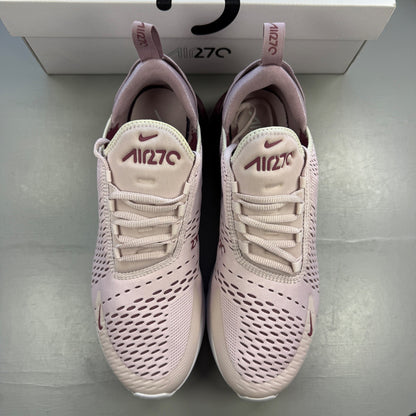 Nike trainers barely rose pink with white accents and Air Max cushioning.