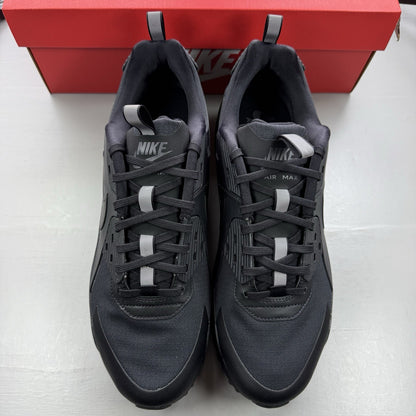 Nike Air Max 90 Drift black trainers with textured upper and signature logo.